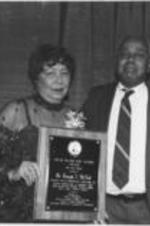 Evelyn G. Lowery poses for a photo with Dr. Joseph A. McNeil at the 15th Annual SCLC/W.O.M.E.N. Drum Major for Justice Awards dinner. McNeil was the recipient of the Drum Major for Justice Award for Civil Rights. Written on verso: Civil Rights Award, Dr. Joseph McNeil.