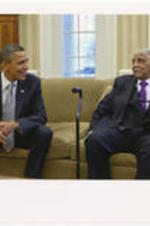 Joseph E. Lowery sits on a couch in the Oval Office of the White House with President Barack Obama.