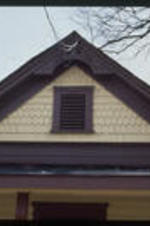 A close up view of the gable on a victorian cottage. Text from slide presentation: . . . and sometimes in the peak of the gable.