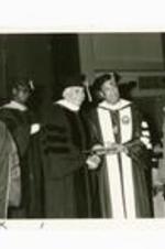 Written on verso: Boisfeuillet Jones receives Honorary Doctorate at 1982 Commencement exercises--May 23, 1982 (L-R) Dr. Cleon Arrington, Dr. Jones, President Gloster, Dr. Willis Hubert.
