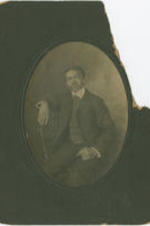 Portrait of Irvin McDuffie sitting in a chair.
