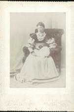 Portrait of Urllie Taylor sitting in a chair.