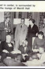 Poet Robert Frost speaks, surrounded by a group of admirers in the lounge of Merrill Hall at Morehouse College. Written on recto: Poet Robert Frost, seated in center, is surrounded by a post-recital group in the lounge of Merrill Hall.