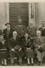 Group photographed outside the Trevor Arnett Library during its dedication. Pictured are (top row, left to right) Trevor Arnett, an unidentified man, Benjamin E. Mays, and unidentified man, Rufus E. Clement, (bottom row, left to right) an unidentified woman, Mrs. Trevor Arnett, an unidentified man, Florence M. Read, Kendall Weisiger, and an unidentified man. Written on verso: Dedication library building. Last man on left on back row may be Trevor Arnett, bottom row, second from left, Mrs. Trevor Arnett?, 4th from left, Mrs. Florence M. Read. First from left, Mr. Trevor Arnett [?], third from left, Dr. Benjamin Mays, last, Dr. Rufus Clement