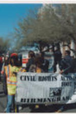 Demonstrators holding a banner that reads "Civil Rights Activist Committee Foot Soldiers - Birmingham, Alabama" march during the Selma Bridge Crossing Jubilee event.