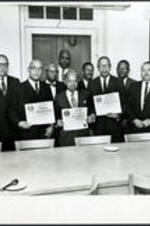 Brailsford R. Brazeal stands with John W. Davis, Charles H. Haynes, and Walter W. Scott in a group presentation from the Morehouse College Alumni Association.
