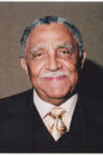 Joseph E. Lowery smiling in suit and tie.