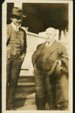 W. E. B. DuBois stands on steps with President Theodore Roosevelt.