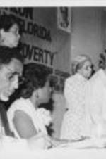 Septima Clark is shown speaking at the 29th Annual Southern Christian Leadership Conference Convention alongside Rosa Parks, Joseph and Evelyn Lowery, and an unidentified woman.