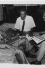 John Nettles, Dick Gregory, and E. Randel T. Osburn are shown sitting down and talking during the 29th Annual Southern Christian Leadership Conference Convention.