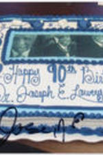 A photo of a birthday cake made for Joseph E. Lowery's 90th birthday. The photo contains a signature: "Jose [illegible]".
