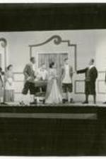 View of actors on stage. Written on verso: "Tartuffe" - March 24-25, 1950.