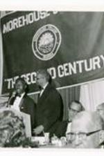 View of two men standing at a podium.