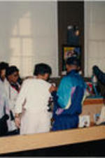 A group of SCLC/W.O.M.E.N. Civil Rights Heritage Tour participants are shown viewing items in a gift shop.