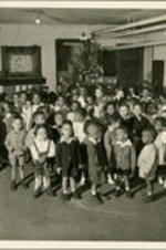 Aurelia Erskine Brazeal (back, far left), daughter of Dr. Brailsford Brazeal, stands in front of a Christmas tree at Spelman Nursery School.