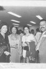 Evelyn G. Lowery poses for a photo with her mother Evelyn Gibson (next to Evelyn) and two other unidentified individuals. Written on recto: Atl[?] Palestinians - Civic Center - Oct '79