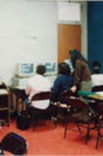A group of women are shown in computer training at the SCLC/W.O.M.E.N. Learning Center.