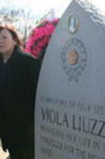 Evelyn G. Lowery and Mary Liuzzo Lilleboe stand next to the SCLC/W.O.M.E.N. memorial monument for Viola Liuzzo, Lilleboe's mother.