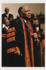 Joseph E. Lowery preaching in a kente cloth clergy robe.