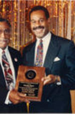 Southern Christian Leadership Conference (SCLC) President Joseph E. Lowery and Walter E. Fauntroy are shown presenting the Frederick Douglass Freedom Award to Emanuel Cleaver at the 35th Annual SCLC Convention in Dayton, Ohio.