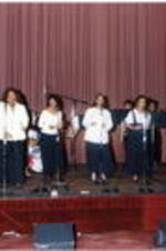 A group of women sing at the Atlanta Student Movement 20th anniversary event.