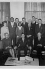 An Official State photo features Ruby D. Smith as she stands with Governor Carl E. Sanders and a group.