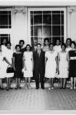 Members of Beta Phi Mu gather for an event. Written on verso: Virginia L. Jones (1strow; 1st right)
