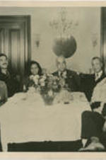 Elizabeth McDuffie (second from right) sits at a table with William Thompkins (fourth from right) and others. Written on recto: To Mrs. Lizzie McDuffie; In memory of a fine friendship; Sam McAllister.