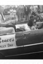 Hank Aaron and two other unidentified Braves players ride in a car in the Braves Pennant Rally parade.