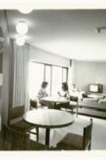 Interior view of students in lounge area of McAlpin Dormitory.