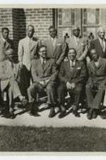 Outdoor group portrait of men, including James H. Touchstone.