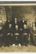 Group portrait of 12 men.