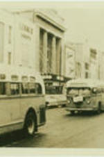 Traffic passes in front of the Lerner Shops and Kress store front in Montgomery, Alabama.