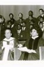 President Hugh Gloster with Leontyne Price and Morehouse College students on stage.