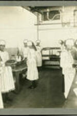 Unidentified female students in cooking class.