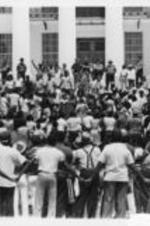 Southern Christian Leadership Conference President Joseph E. Lowery (in center of photo, at podium), addresses a crowd in front of the State Capitol in Montgomery, Alabama. Lowery's address was, in part, in response to the killings of Hamp Russaw and Anthony Russaw by police in Eufaula, Alabama.