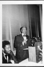 A man speaks from the podium at an ITC banquet.