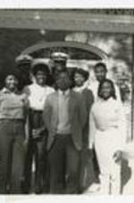 Outdoor group portriat of young men and women. Written on verso: "McBrown-1985; Sophomore class off: President Tony Griffin; L to Right; Marcus Willims, Dorletha Frazier, Tracy Buchanan, Angela Brown, William Tanks, Roderick Price, Ronald Williams".