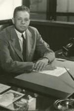 John H. Wheeler sits at his desk at the Mechanics and Farmers Bank, in Durham, North Carolina.