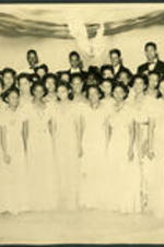 Vivian Wilson Henderson and unidentified men and women pose for a group photo at the Pan-Hellenic Dance, possibly at North Carolina College in Durham, North Carolina.