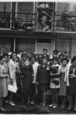A crowd of women are shown gathered for a picture outside of the Lorraine Motel where Martin Luther King, Jr. was assassinated on April 4, 1968.