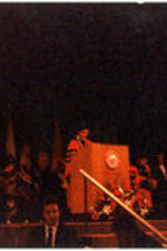 Men in regalia stand on a stage for C. Eric Lincoln receiving an honorary degree from Boston University.
