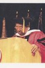 C. Eric Lincoln speaks from the podium while receiving an honorary degree from Boston University.