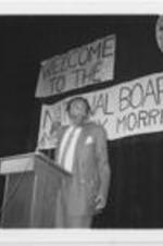 Dick Gregory speaks at a Southern Christian Leadership Conference campaign event advocating against youth drug and alcohol abuse. Written on verso: Dick Gregory addresses the enthusiastic crowd against the use of drugs.