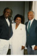 James Costen and Mance Jackson stand with an unidentified woman. Written on verso: Costen, Mance Jackson.