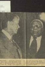 Newspaper photo of Democratic presidential candidate Jimmy Carter with Martin Luther King Sr. prior to addressing members of the Voter Education Project in regards to an automatic voter registration bill. 1 page.