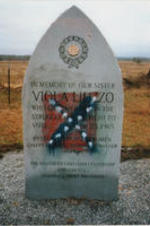 A picture of Viola Liuzzo's memorial monument is shown vandalized with a painting of a Confederate flag.