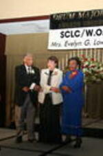 Joseph E. Lowery, Evelyn G. Lowery, and Christine King Farris join hands and sing "We Shall Overcome" at the 30th Annual SCLC/W.O.M.E.N. Drum Major for Justice Awards Dinner.