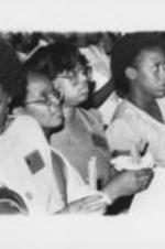 SCLC/WOMEN members are shown in attendance at the National Women's Candlelight Prayer Service. The prayer service was dedicated to the memory of Atlanta's missing and murdered children and their families. Written on verso: Members of SCLC/WOMEN participate in the candlelight Memorial March and Rally.