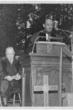 Dr. Harry V. Richardson speaks from the podium. Written on verso: Inauguration of Dr. Harry V. Richardson.